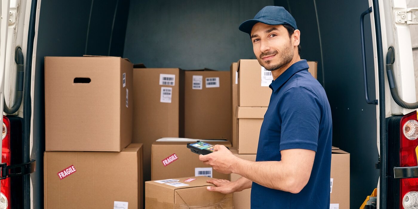 Using a mobile barcode scanner to scan goods on a delivery truck